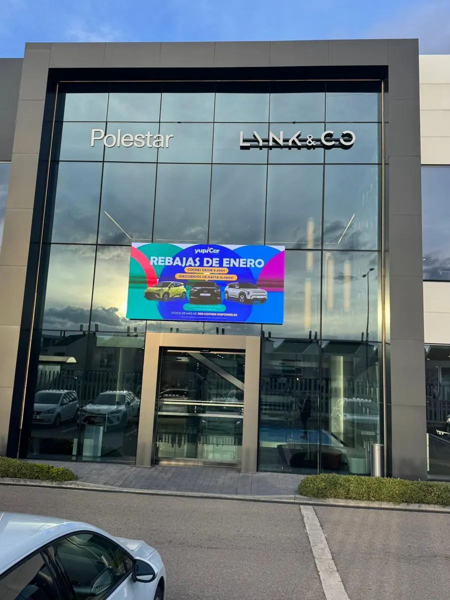 LED screen in the glazed shop window of Yupica